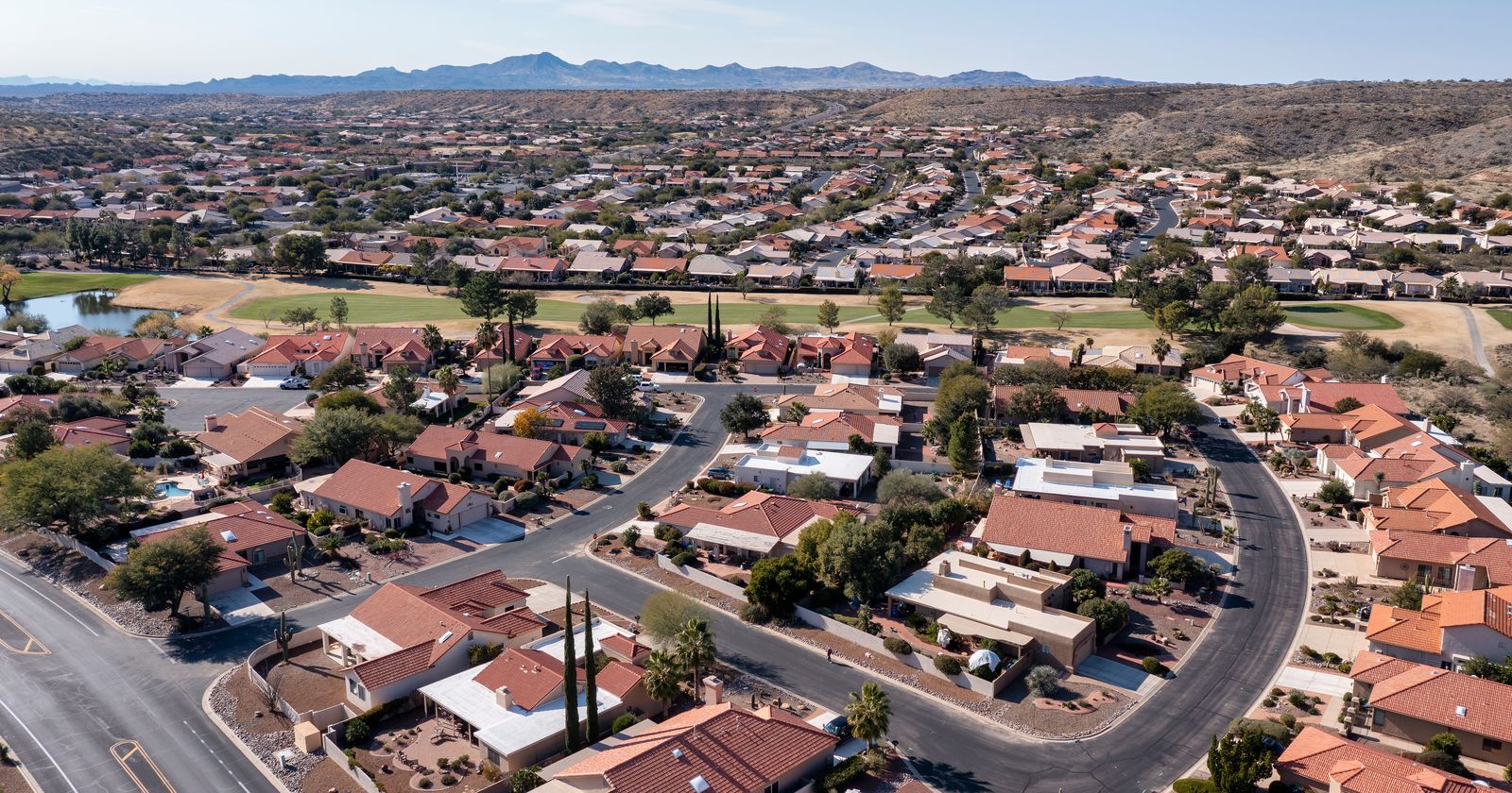 Aerial view of a tile-roofed neighborhood in the Southern Arizona desert
